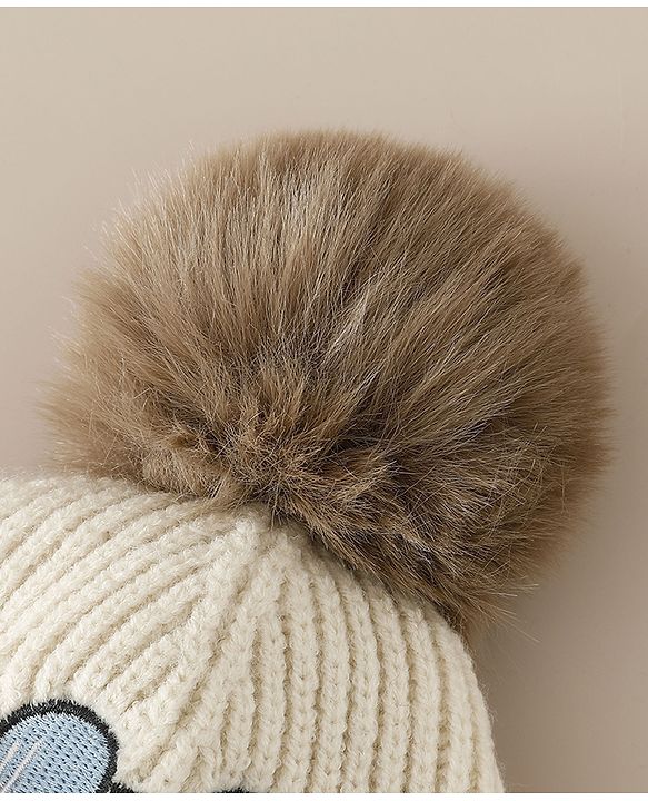 Babyhug Woollen Cap with Pom Pom & Animal Applique in Sky Blue - Diameter 16 cm