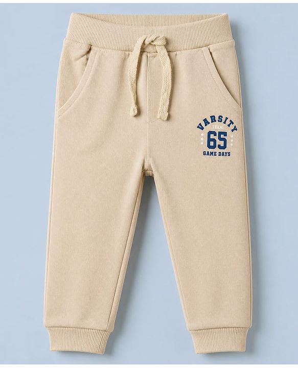 Babyhug Cotton Terry Knit Jogger Fit Full Length Lounge Pant with Varsity Team Text Print - Beige