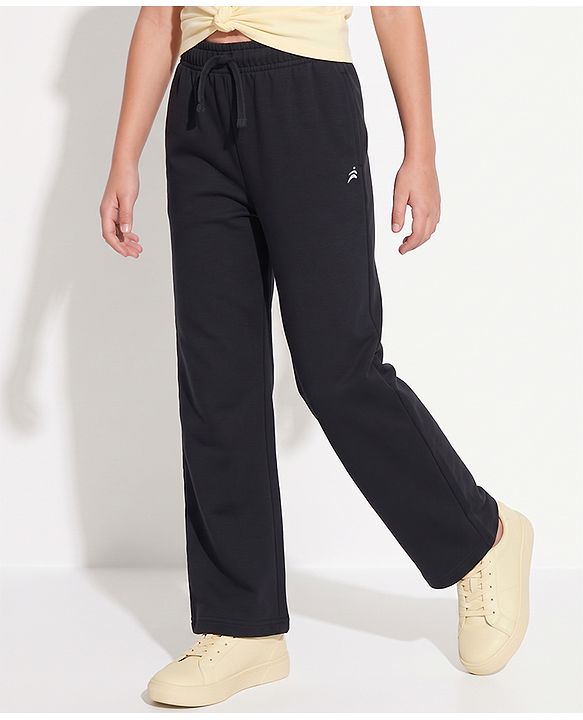 Pine Active Knit Full Length Solid Flared Pant with Logo Print in Black