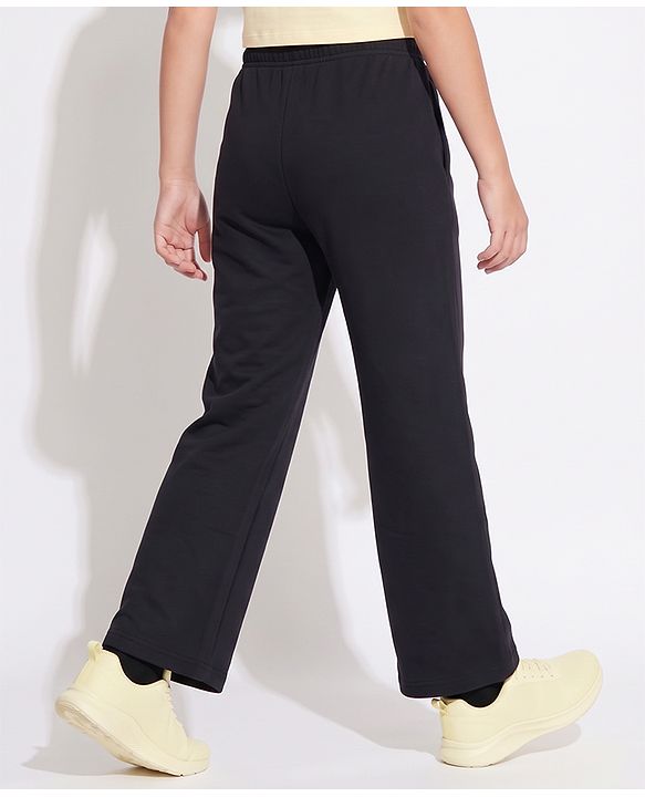 Pine Active Knit Full Length Solid Flared Pant with Logo Print in Black
