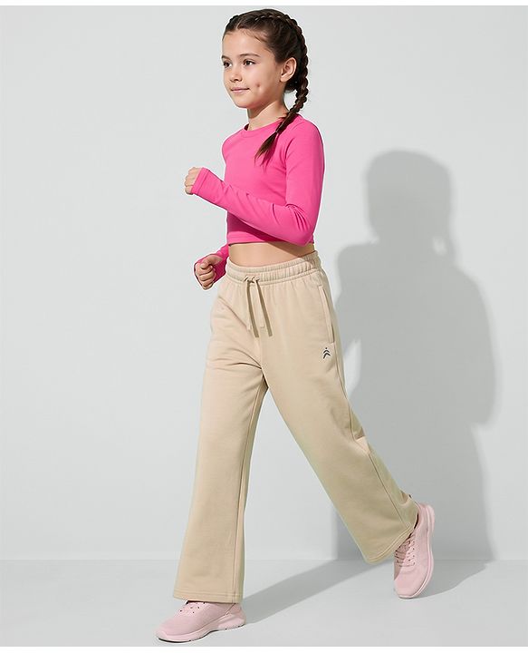 Pine Active Knit Full Length Solid Flared Track Pants in Beige