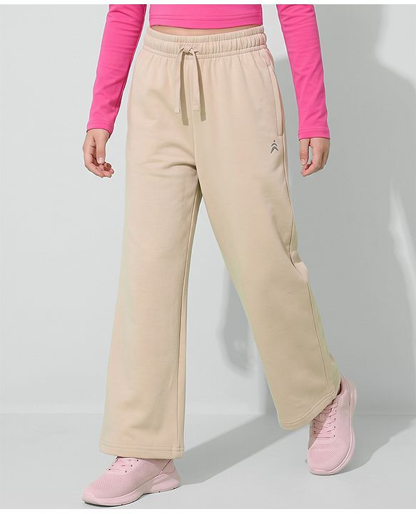 Pine Active Knit Full Length Solid Flared Track Pants in Beige