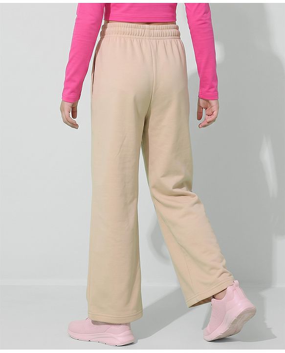 Pine Active Knit Full Length Solid Flared Track Pants in Beige