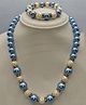 Little Blossom Glossy Finish Pearl And Diamond Necklace Bracelet Set - Blue