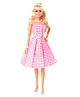 Barbie The Movie Doll Wearing Pink and White Gingham Dress with Daisy Chain Necklace - Height 29.5 cm