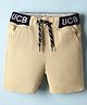 UCB Cotton Woven Knee Length Solid Coloured Shorts With Brand Embroidery - Beige