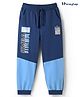 HoneyHap Disney Terry Knit Full Length Cut & Sew Trackpants With Simba Graphic & Badge Detailing - Blue