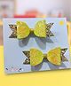 NYRA DESIGN STUDIO Set Of 2 Bow Designed Shimmered Hair Clips - Yellow & Golden
