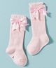 Cute Walk by Babyhug Non Terry Knit Calf Length Solid Party Socks with Bow Applique & Cable Knit Design - Pink