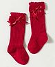 Cute Walk by Babyhug Non Terry Knit Calf Length Solid Party Socks with Bow Applique & Cable Knit Design - Red