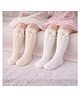 The little lookers Cotton Knit Pack Of 2 Bow & Crown Applique Detailed Pearls Embellished Socks - White & Skin