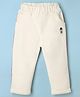 Ollypop Woven Full Length Solid Trousers With Text Print In Side Strips - Off White