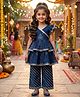 The Magic Wand Cambric Woven Sleeveless Ruffle Leheriya Layered Peplum Top and Pant Set with Leaf Print in Navy Blue