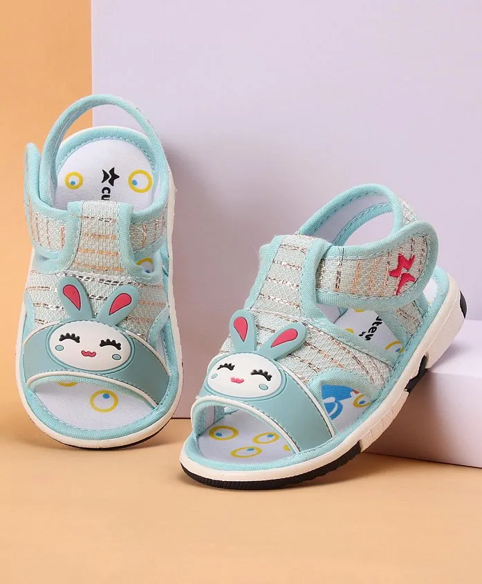 https://cdn.fcglcdn.com/brainbees/images/products/cute-walk-by-babyhug-slip-on-sandals-with-bunny-applique-and-velcro-closure-blue-13874004a.webp