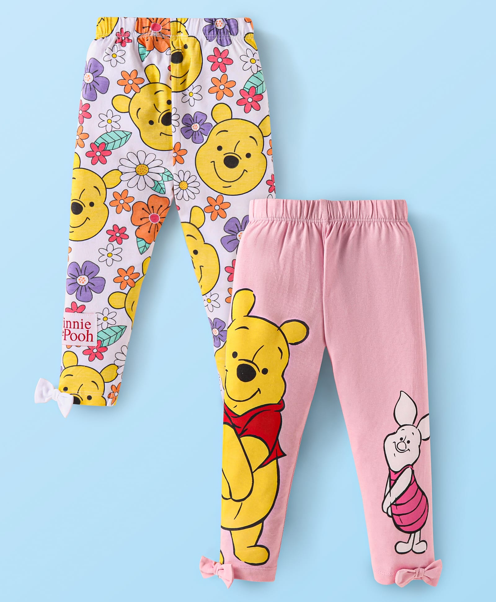 Babyhug Disney Lycra Knit Leggings With Winnie the Pooh Graphics With Bow & Badge Detailing Pack of 2 - Yellow & Pink-picture-15