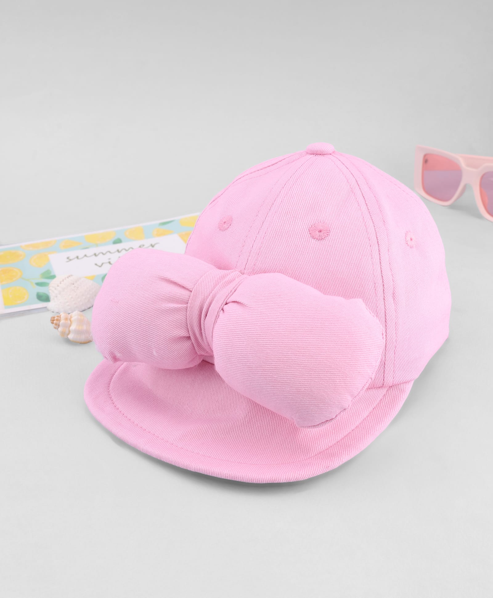 Babyhug Cotton Knit Baseball Cap with Bow Applique Pink- Diameter 17 cm