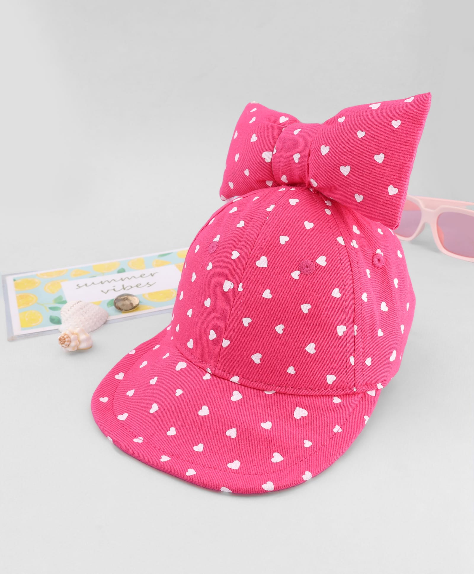Babyhug Cotton Knit Baseball Cap with Heart Print & Bow Applique Pink- Diameter 18 cm