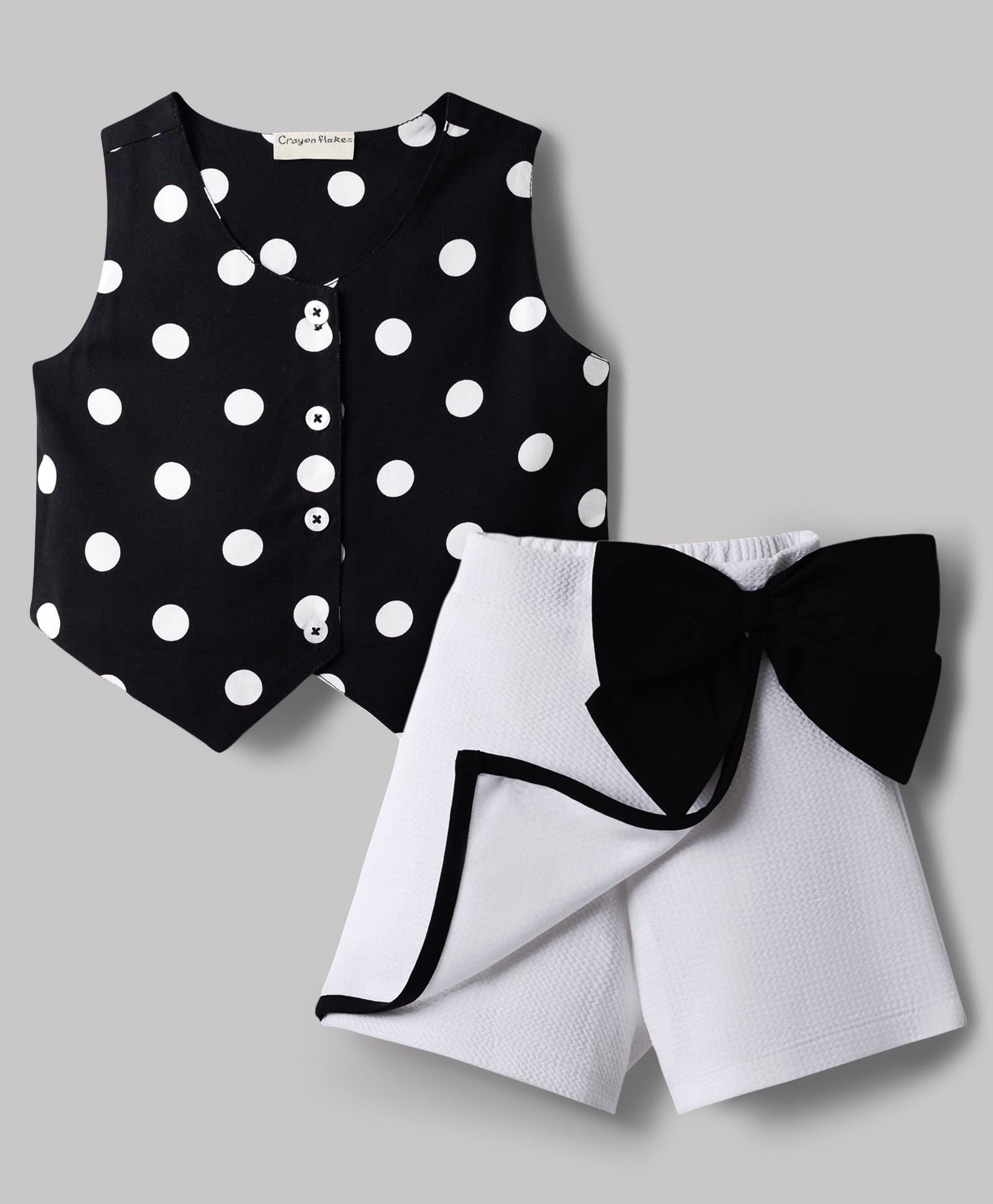 CrayonFlakes Rayon Knit Sleeveless Polka Dots Printed Top & Bow Applique Detailed Skort Set - Black-picture-11